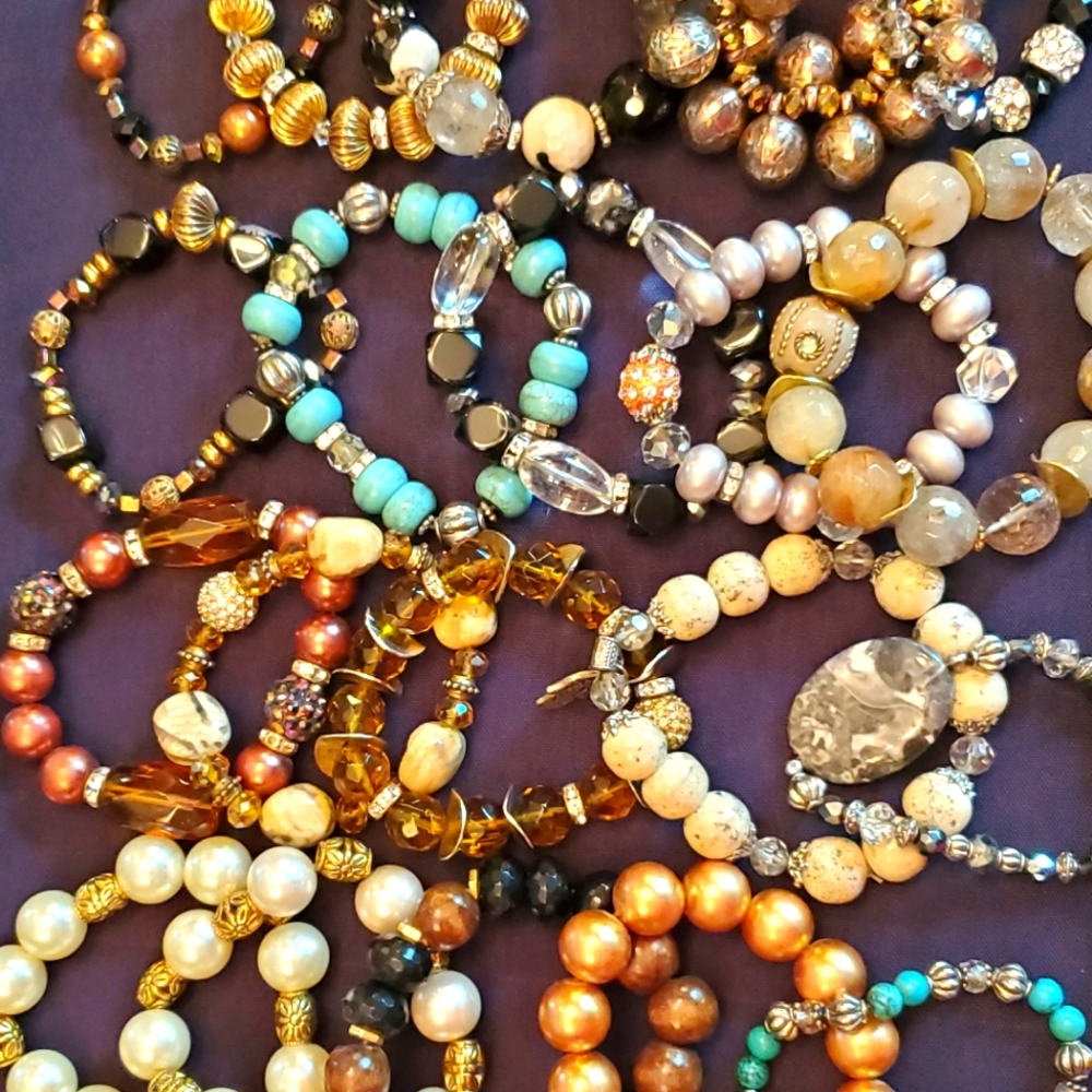 28 beaded bracelets on stretch elastic.